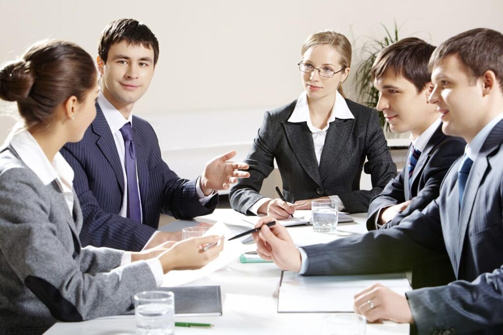Legal support professionals discussing UK law firm process solutions